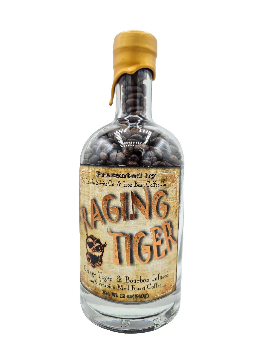 Glass bottle of Raging Tiger bourbon barrel aged medium roast coffee beans with wax seal